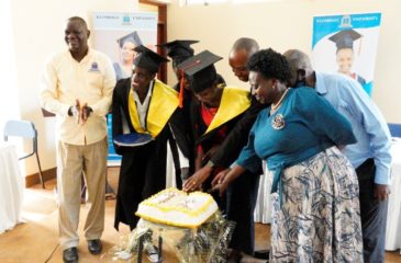 Graduands cutting cake during the graduation ceremony