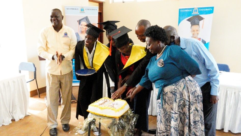 Graduands cutting cake during the graduation ceremony