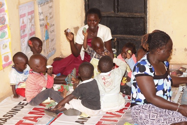One of the caregivers playing with the children.