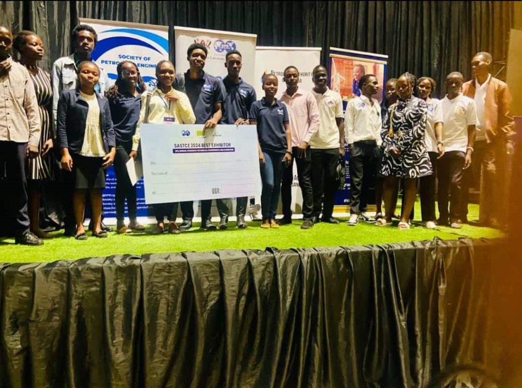 Students of Kyambogo University from the Department of Mining, Chemical and Petroleum Engineering pose for a photo after winning an award for the best exhibition during the Society of Petroleum Engineers Annual Students' Technical Conference and Exhibition (SASTCE) held at Makerere University