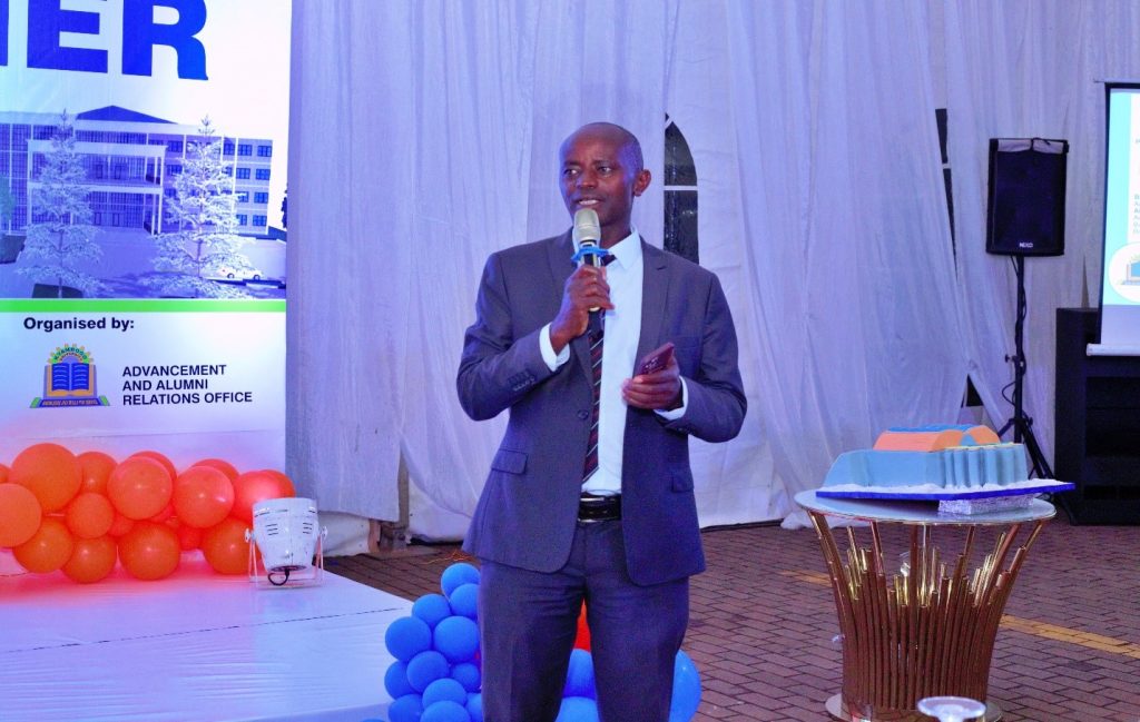 Mr. Arthur Katongole, the University Secretary giving clarity to participants about the financial management system in place during the fundraising dinner at Hotel Africana.