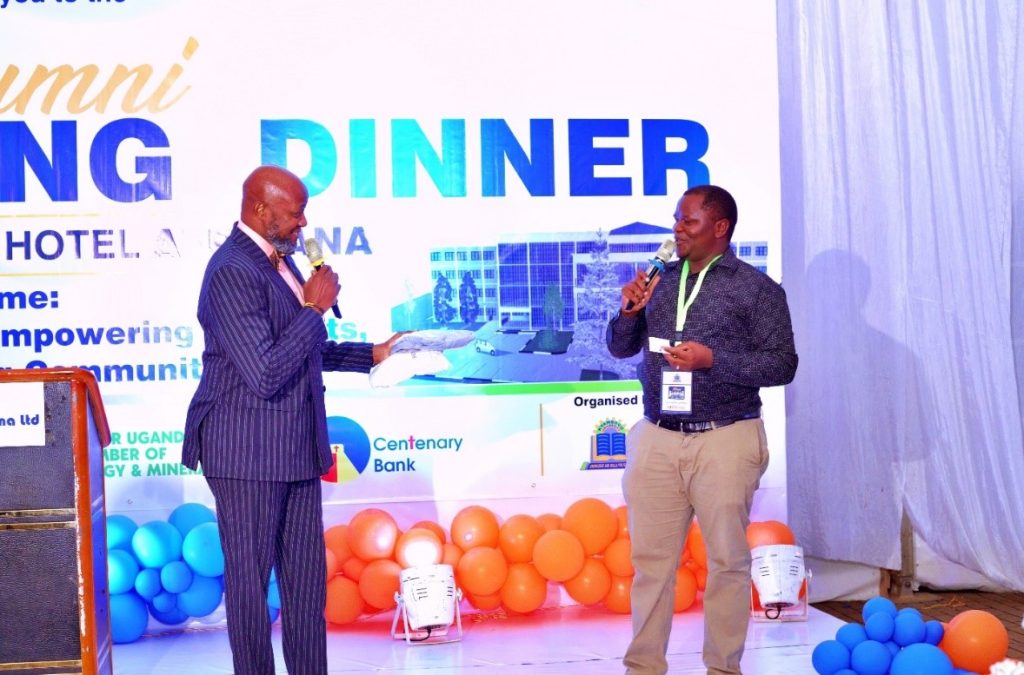 The MCs, Mr. Kasumba Samson on the Left and Mr. Lagalavu Lawrence on the Right on stage making their communication to the participants during the fundraising dinner at Hotel Africana.