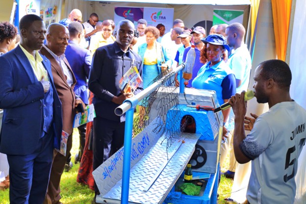 Mr. Jimmy Mwanja explain the mechanism of action of his machine