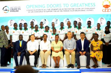 The Kyambogo University awardees, staff and sponsors pose for a photo after the launch of the EACOP-CPP Scholarship at Sheraton Hotel.