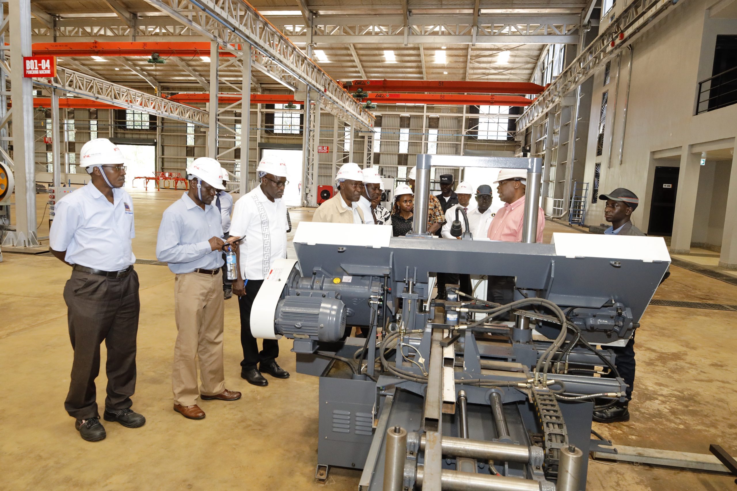Prof. Eli Katunguka leads Kyambogo University management and academic staff on a guided inspection of the Kiira Motors Vehicle Plant as the institution explores strategic partnerships to enhance practical engineering training and national industrial development.