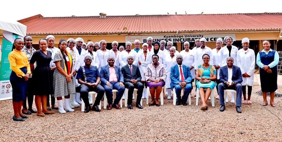 Permanent Secretary Dr. Kedrace Turyagyenda with Kyambogo University staff and participants during the bakery training launch.