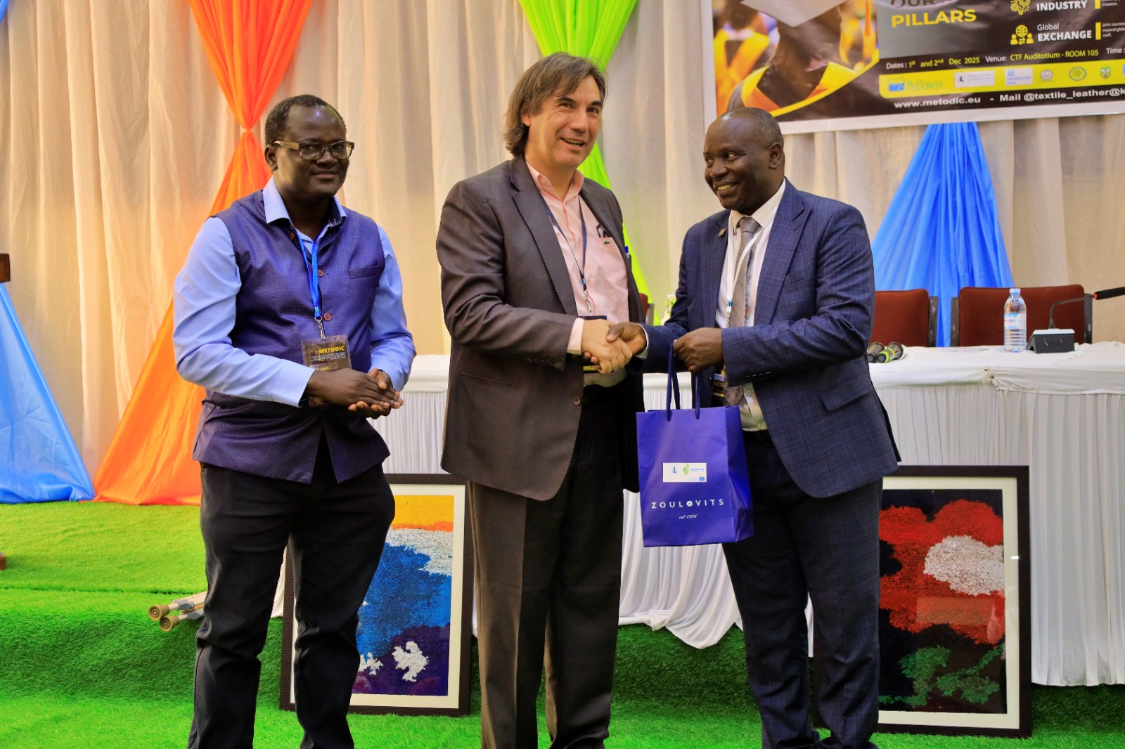 Dean Faculty of Science, Assoc. Prof. Edirisa Mugampoza exchanging gifts with METODIC project coordinator Prof. Georgios Priniotakis of the University of West Attica