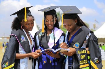 Graduands are excited to find their names in the graduation booklet