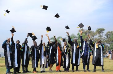 Kyambogo University Graduands celebrate their achievement with the traditional hat toss at the 21st Graduation Ceremony.