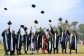 Kyambogo University Graduands celebrate their achievement with the traditional hat toss at the 21st Graduation Ceremony.