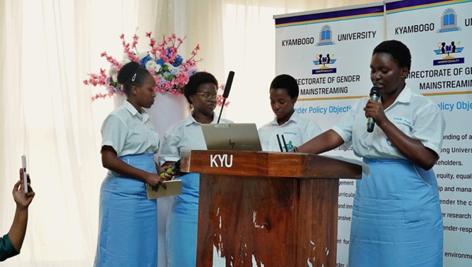 Girls of Nabisunsa presenting a poem at the celebrations 
