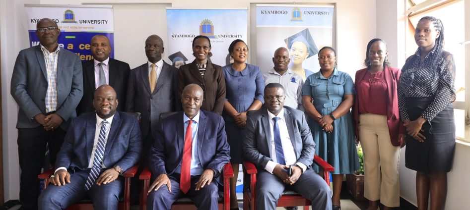 The Vice Chancellor Kyambogo University, Prof. Eli Katunguka (middle), with the Vice Chancellor Accra Technical University, Engr. Prof. Amevi Acakpovi (left) pose for a group photo with other members of the 2 universities after signing MoU