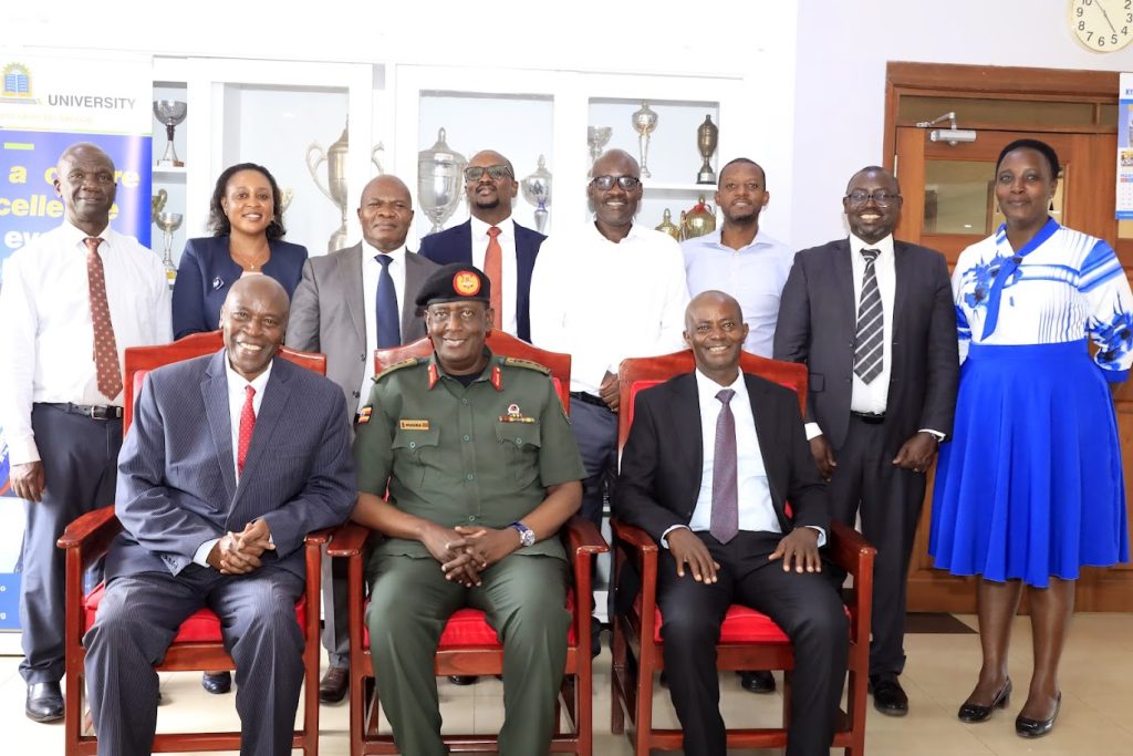 Members of Top Management with the NEC team after the signing of an MoU