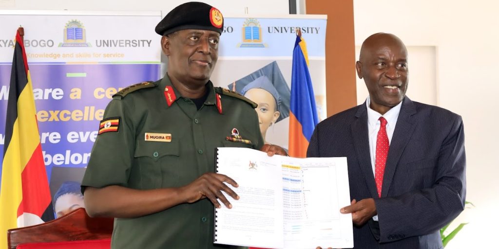 The Managing Director of NEC, Lt. Gen. James Mugira with the Vice Chancellor, Prof. Eli Katunguka Rwakishaya after signing an MoU