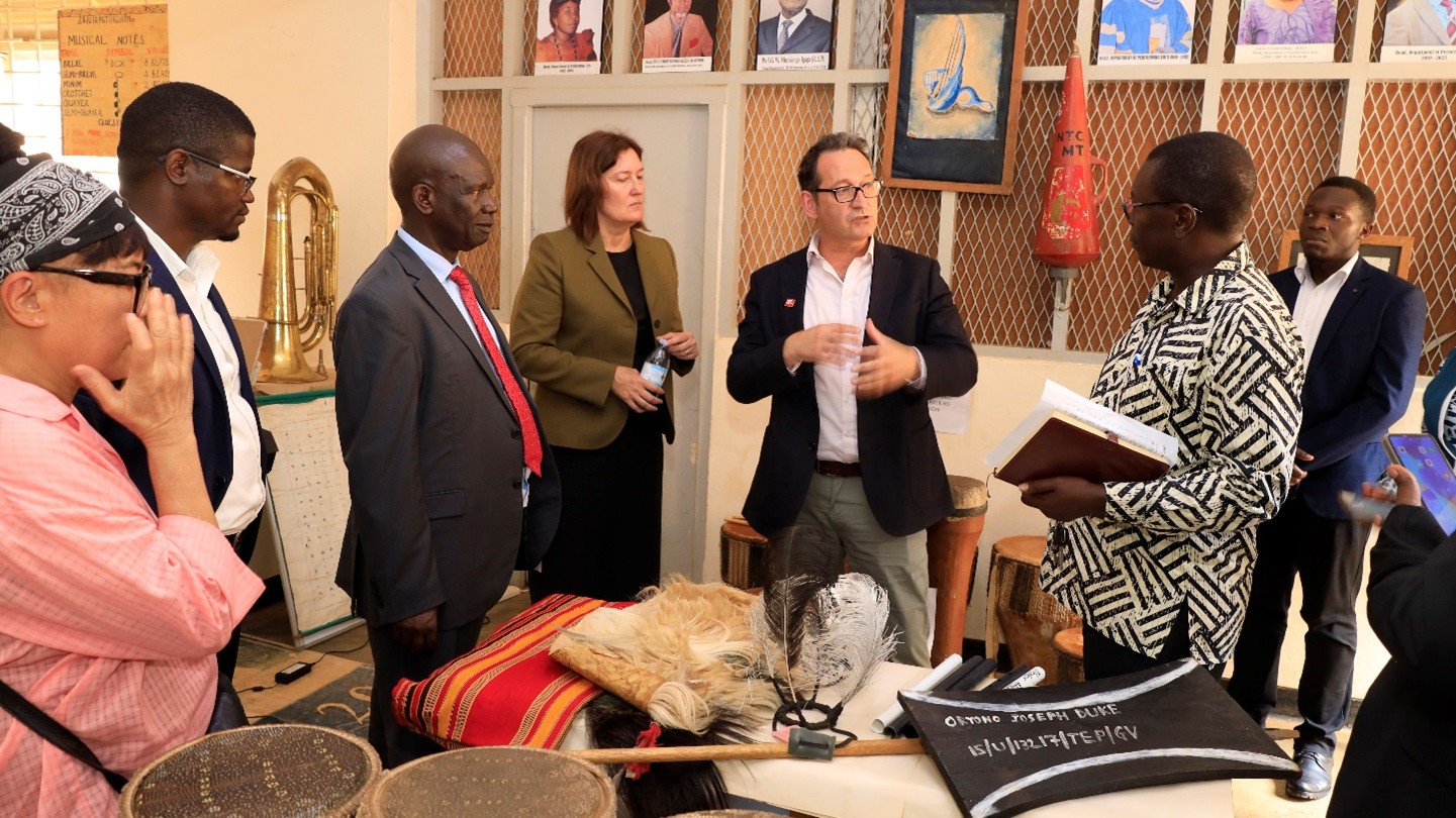 The head of the department of performing arts showcasing some of the music instruments invented by students