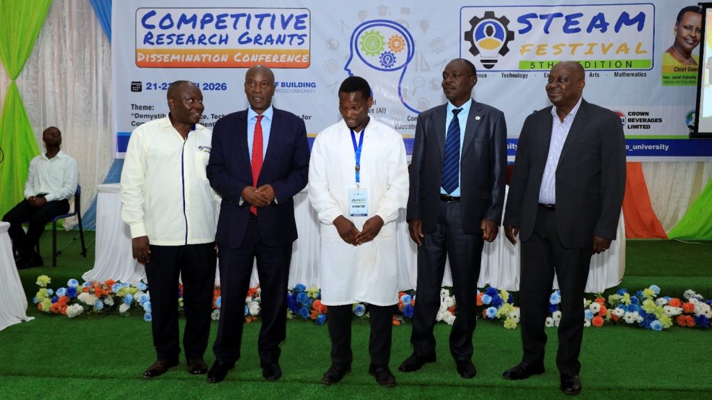 The overall winner of the STEAM 5th edition(middle) poses for a photo with dignitaries. 