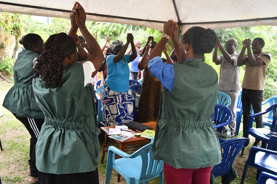 Facilitators from RUFS with the farmers in a learning experiment during one of the trainings.