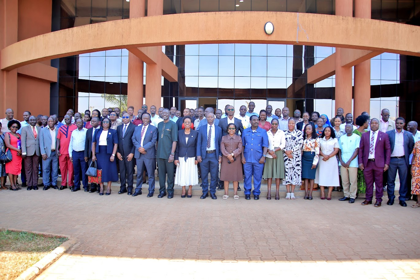 Guests and participants pose for a group photo