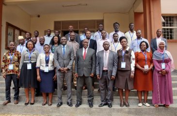 Participants pose for a group photo after the malaria workshop