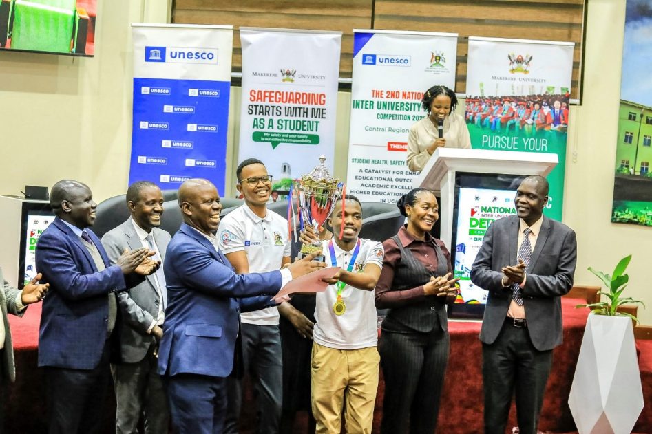 The Winners lifting high the trophy amidst joy with the Principal Warden, Mr. Ngabirano with UNESCO and MoE & Sports Officials