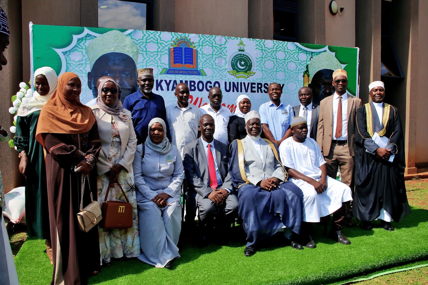 Sheikh Shaban Ramadhan Mubaje, with the Deputy Vice Chancellor F&A Assoc. Prof. Kwetegyeka pose for a group photo with members of staff